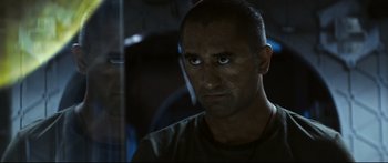 Movie still from “Sunshine” (2007), directed by Danny Boyle – A person wearing a green shirt; Close Up shot, Over the shoulder angle