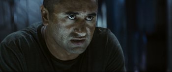 Movie still from “Sunshine” (2007), directed by Danny Boyle – A person with blue eyes; Close Up shot, Over the shoulder angle