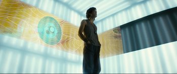 Movie still from “Sunshine” (2007), directed by Danny Boyle – A man standing in front of an image of a plane; Medium shot, Low angle