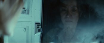 Movie still from “Sunshine” (2007), directed by Danny Boyle – A woman looking out of a window at night; Close Up shot, Low angle