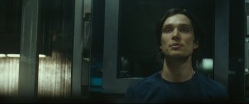 Movie still from “Sunshine” (2007), directed by Danny Boyle – A man sitting in front of a mirror on a train; Close Up shot, Low angle