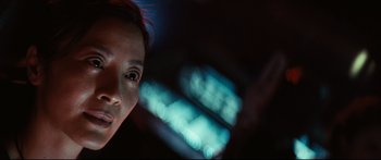 Movie still from “Sunshine” (2007), directed by Danny Boyle – A woman with red hair is looking at the camera; Close Up shot, Low angle