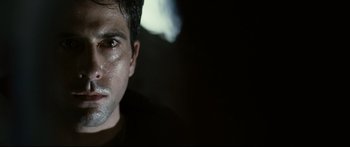 Movie still from “Sunshine” (2007), directed by Danny Boyle – A person's face in the dark; Close Up shot, Over the shoulder angle