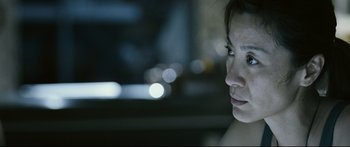 Movie still from “Sunshine” (2007), directed by Danny Boyle – A woman's face in the dark; Close Up shot, Over the shoulder angle