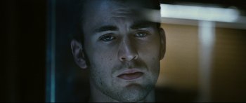 Movie still from “Sunshine” (2007), directed by Danny Boyle – A man's face looking at the camera; Close Up shot, Low angle