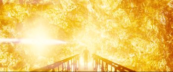 Movie still from “Sunshine” (2007), directed by Danny Boyle – A man is standing on a bridge in front of a bright light; Extreme Wide shot, High angle