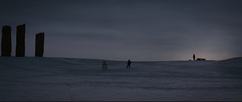 Movie still from “Sunshine” (2007), directed by Danny Boyle – A person is walking through the snow at night; Extreme Wide shot, Low angle