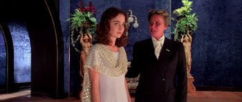 Movie still from “Suspiria” (1977), directed by Dario Argento – A woman and a young girl standing next to each other; Medium shot, Over the shoulder angle
