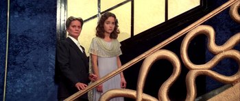 Movie still from “Suspiria” (1977), directed by Dario Argento – A woman standing next to a young girl on a staircase; Medium shot, Low angle