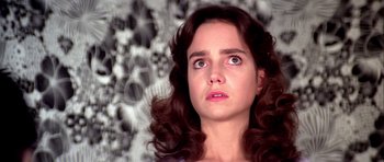 Movie still from “Suspiria” (1977), directed by Dario Argento – A person with long brown hair; Close Up shot, Low angle