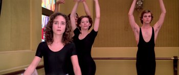 Movie still from “Suspiria” (1977), directed by Dario Argento – A group of women are practicing a dance move; Medium shot, Low angle