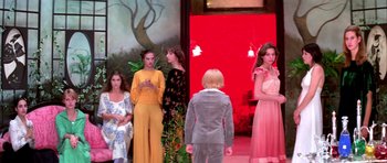 Movie still from “Suspiria” (1977), directed by Dario Argento – A group of women standing next to each other on a stage; Wide shot, Low angle