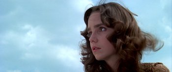 Movie still from “Suspiria” (1977), directed by Dario Argento – A person with long brown hair; Close Up shot, Low angle