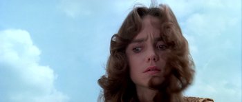 Movie still from “Suspiria” (1977), directed by Dario Argento – A person with long brown hair; Close Up shot, Low angle