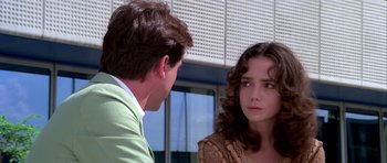 Movie still from “Suspiria” (1977), directed by Dario Argento – A man and a woman talking to each other outside; Close Up shot, Over the shoulder angle