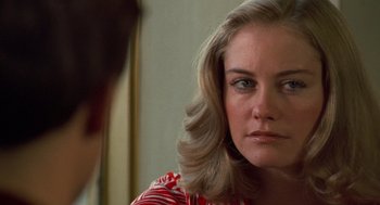 Movie still from “Taxi Driver” (1976), directed by Martin Scorsese – A person with long blonde hair; Close Up shot, Over the shoulder angle