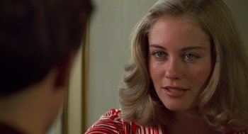 Movie still from “Taxi Driver” (1976), directed by Martin Scorsese – A person wearing a red and white striped shirt; Close Up shot, Over the shoulder angle