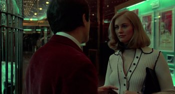 Movie still from “Taxi Driver” (1976), directed by Martin Scorsese – A man and a woman are talking in a room; Medium shot, Over the shoulder angle