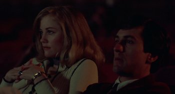 Movie still from “Taxi Driver” (1976), directed by Martin Scorsese – A man and a woman sitting next to each other; Close Up shot, Low angle