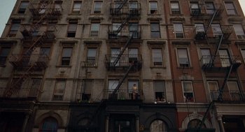 Movie still from “Taxi Driver” (1976), directed by Martin Scorsese – A fire escape on the side of an apartment building; Extreme Wide shot, Low angle