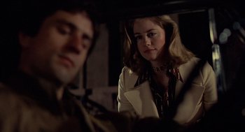 Movie still from “Taxi Driver” (1976), directed by Martin Scorsese – A man and a woman looking in a mirror; Close Up shot, Over the shoulder angle