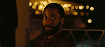 Movie still from “Tenet” (2020), directed by Christopher Nolan – A person with a beard; Close Up shot, High angle