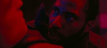 Movie still from “Tenet” (2020), directed by Christopher Nolan – A person with blue eyes; Extreme Close Up shot, Overhead angle