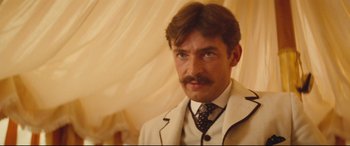 Movie still from “Tess” (1979), directed by Roman Polanski – A person wearing a suit and tie; Close Up shot, Low angle