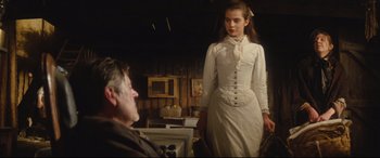 Movie still from “Tess” (1979), directed by Roman Polanski – A man and a woman dressed in old fashioned clothing; Medium shot, Over the shoulder angle