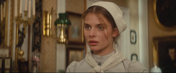 Movie still from “Tess” (1979), directed by Roman Polanski – A woman in a white hat and a white dress; Close Up shot, Over the shoulder angle