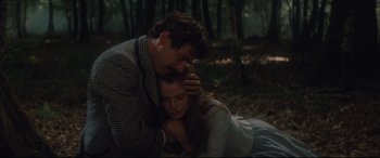Movie still from “Tess” (1979), directed by Roman Polanski – A man and a woman laying on the ground in the woods; Close Up shot, High angle