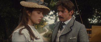 Movie still from “Tess” (1979), directed by Roman Polanski – A man and a woman standing next to each other in front of a forest; Close Up shot, Low angle