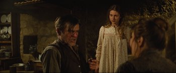 Movie still from “Tess” (1979), directed by Roman Polanski – A man and a woman standing next to each other; Medium shot, Over the shoulder angle