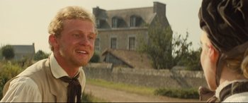 Movie still from “Tess” (1979), directed by Roman Polanski – A man standing in front of an old house; Close Up shot, Low angle