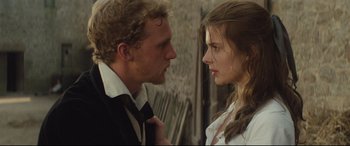 Movie still from “Tess” (1979), directed by Roman Polanski – A man and a woman face to face in front of a brick wall; Close Up shot, Over the shoulder angle