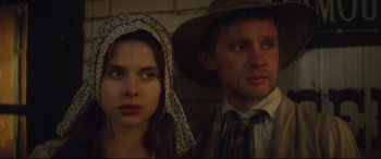 Movie still from “Tess” (1979), directed by Roman Polanski – A man and a woman standing next to each other; Close Up shot, Low angle