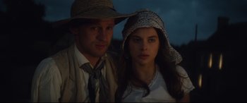 Movie still from “Tess” (1979), directed by Roman Polanski – A man and a woman wearing a hat; Close Up shot, Low angle