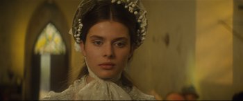 Movie still from “Tess” (1979), directed by Roman Polanski – A young woman wearing an old fashioned hat; Close Up shot, Low angle