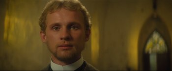 Movie still from “Tess” (1979), directed by Roman Polanski – A person wearing a suit and tie; Close Up shot, Low angle