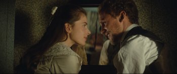 Movie still from “Tess” (1979), directed by Roman Polanski – A man and a woman looking at one another in front of a mirror; Close Up shot, Over the shoulder angle