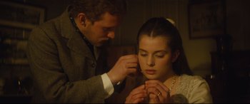 Movie still from “Tess” (1979), directed by Roman Polanski – A man putting a ring on a woman's finger; Close Up shot, Over the shoulder angle