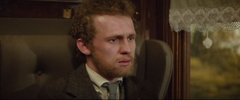 Movie still from “Tess” (1979), directed by Roman Polanski – A person wearing a suit and tie; Close Up shot, Over the shoulder angle