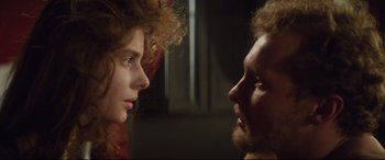 Movie still from “Tess” (1979), directed by Roman Polanski – A man and a woman face to face in a dark room; Close Up shot, Over the shoulder angle
