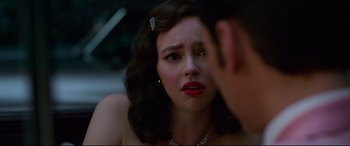 Movie still from “Elvis” (2022), directed by Baz Luhrmann – A young woman is looking at a young man; Close Up shot, Over the shoulder angle