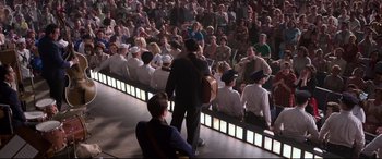 Movie still from “Elvis” (2022), directed by Baz Luhrmann – A crowd of people sitting in front of an audience; Wide shot, High angle