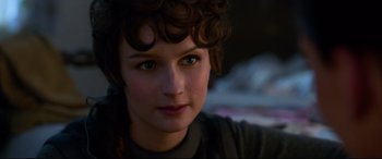 Movie still from “Elvis” (2022), directed by Baz Luhrmann – A woman's face in the dark; Close Up shot, Over the shoulder angle