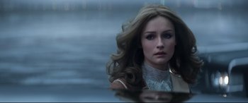 Movie still from “Elvis” (2022), directed by Baz Luhrmann – A beautiful young woman with long , blonde hair; Close Up shot, Over the shoulder angle