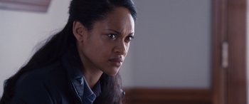 Movie still from “The Accountant” (2016), directed by Gavin O'Connor – A person looking at the camera; Close Up shot, Over the shoulder angle