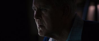 Movie still from “The Accountant” (2016), directed by Gavin O'Connor – An older man is looking into the distance; Close Up shot, Low angle