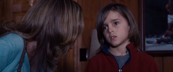 Movie still from “The Accountant” (2016), directed by Gavin O'Connor – A young boy is looking at another young boy; Close Up shot, Over the shoulder angle